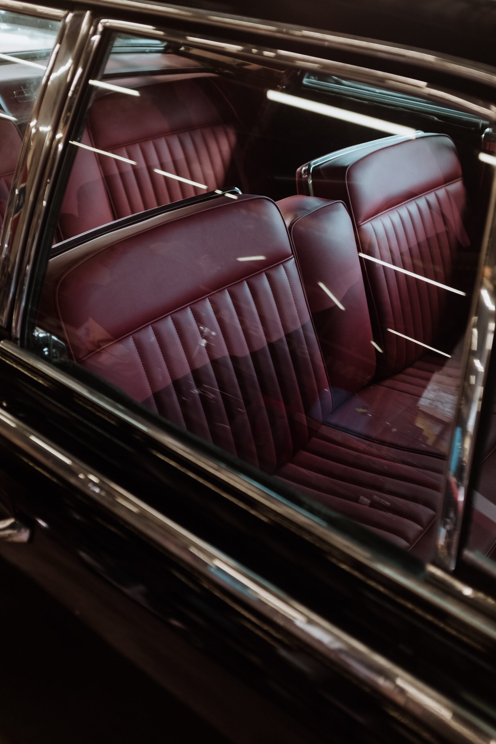 A car with red seats and chrome trim.